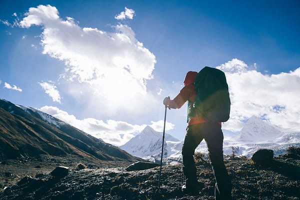 back packer hiking in winter